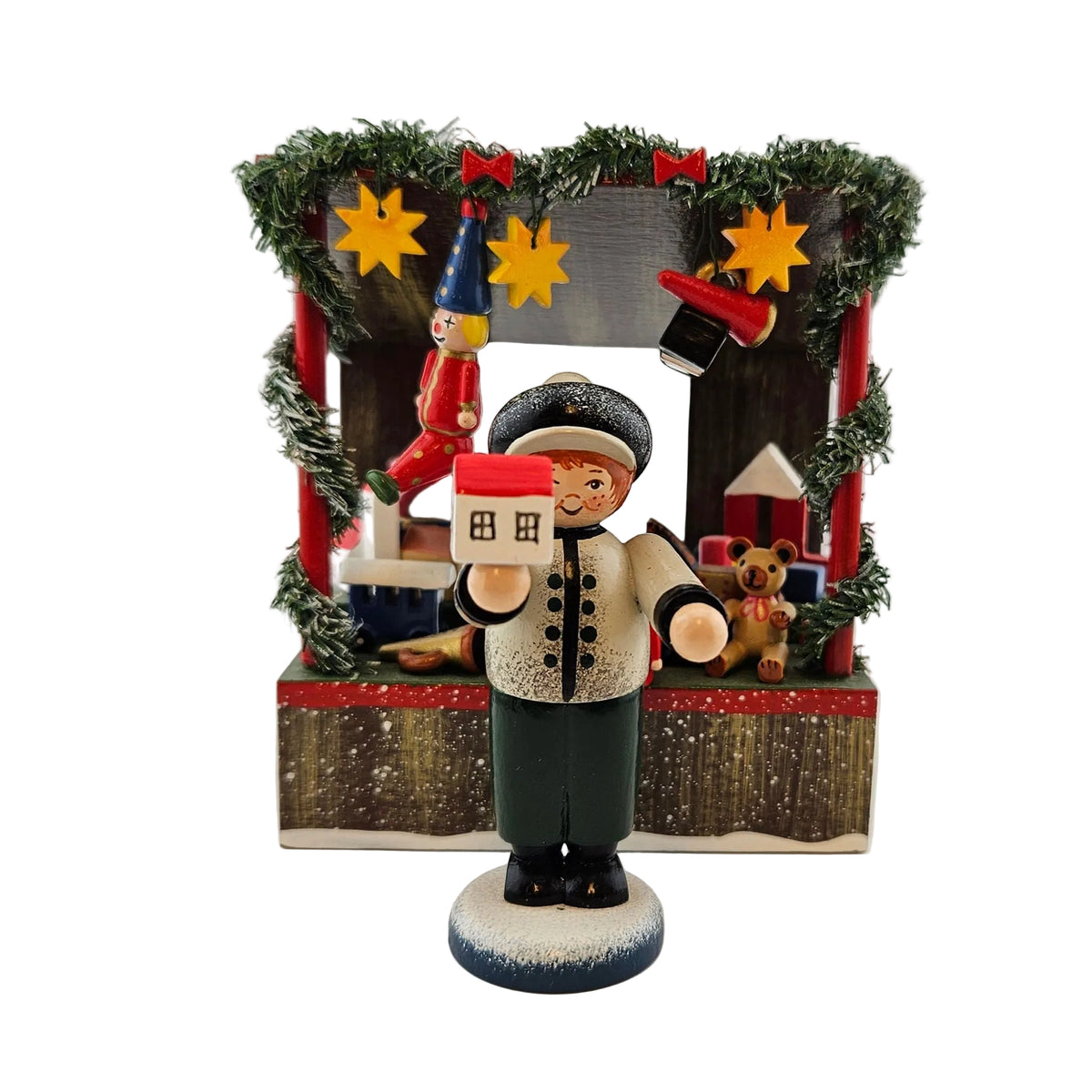 Käthe Wohlfahrt Spielwarenstand mit Händlerfigur Weihnachtsmarkt, Ansicht von vorne mit Verkäufer